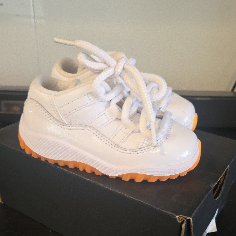 Jordan 11 Kids White and Orange Sneakers